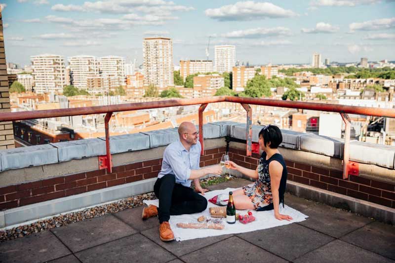 couple celebrating on rooftop