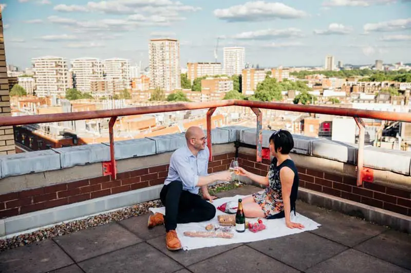 couple celebrating on rooftop